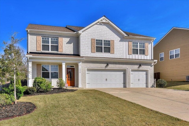 view of front of house featuring a garage and a front lawn