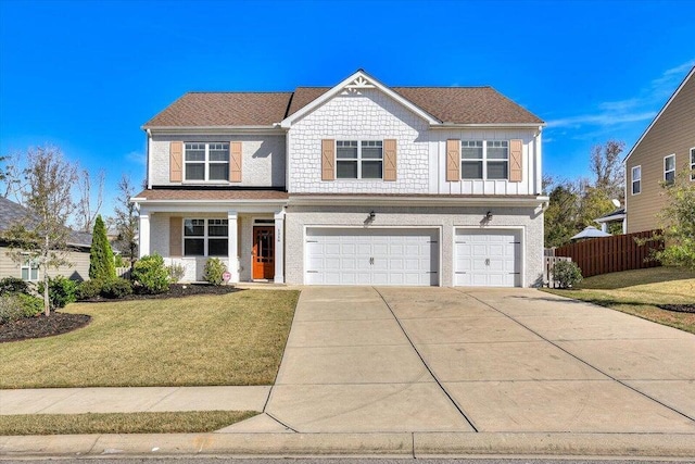 view of front of property with a garage and a front yard