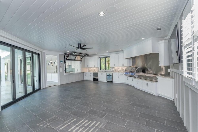 interior space with grilling area, beverage cooler, and exterior kitchen