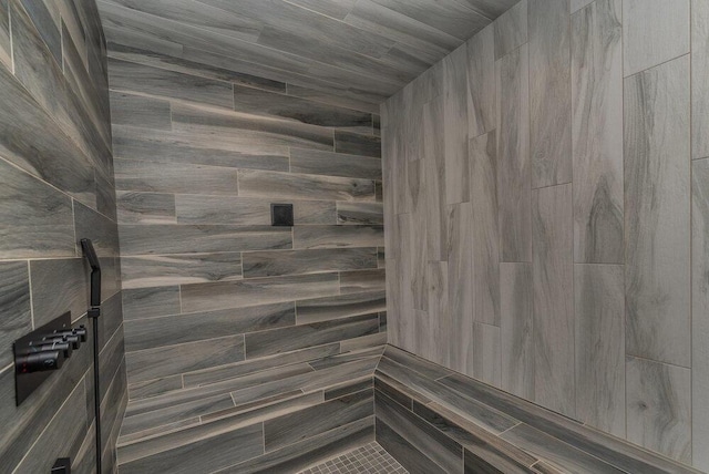 bathroom with a tile shower