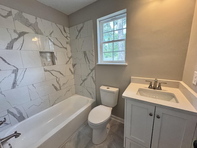 full bathroom with vanity, toilet, and tiled shower / bath combo