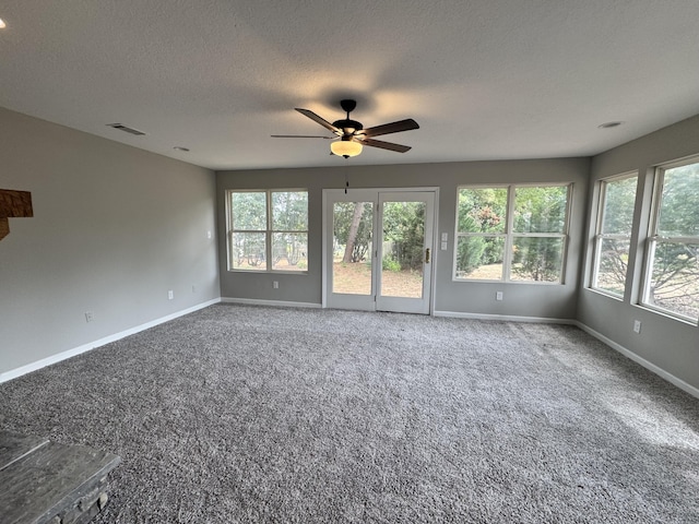 unfurnished room with a textured ceiling and ceiling fan