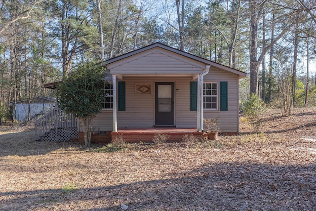 view of front of home featuring covered porch and crawl space