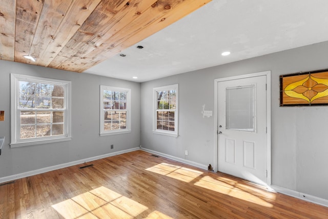 entryway featuring visible vents, baseboards, wood ceiling, wood finished floors, and recessed lighting