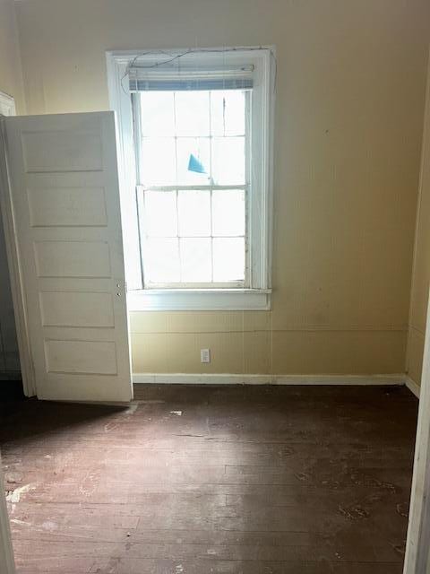 1620 12th St, Augusta, GA 30901 - unfurnished room featuring plenty of natural light, dark wood-style flooring, and baseboards