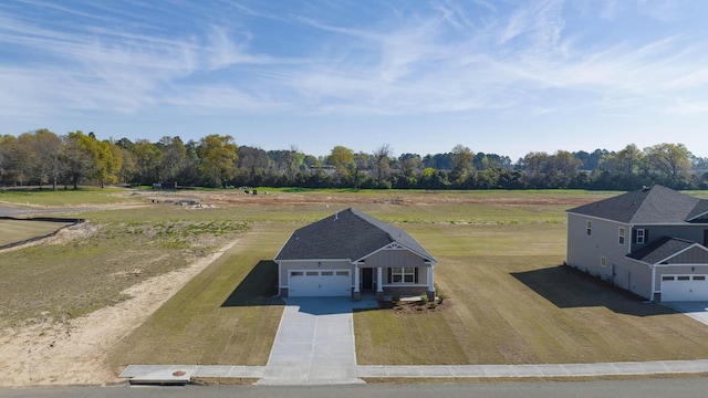 birds eye view of property featuring a rural view