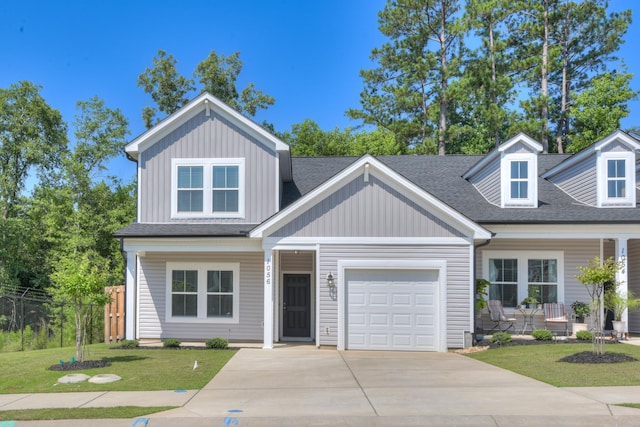 1056 Candleberry Dr, Grovetown, GA 30813 - view of front facade featuring covered porch, board and batten siding, an attached garage, driveway, and a shingled roof