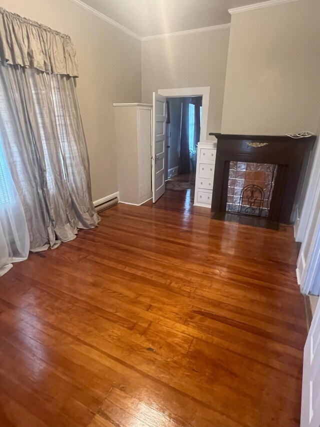 unfurnished living room featuring dark hardwood / wood-style flooring and crown molding