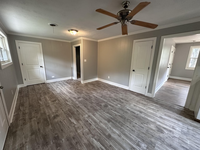 spare room featuring ceiling fan, dark hardwood / wood-style flooring, and ornamental molding