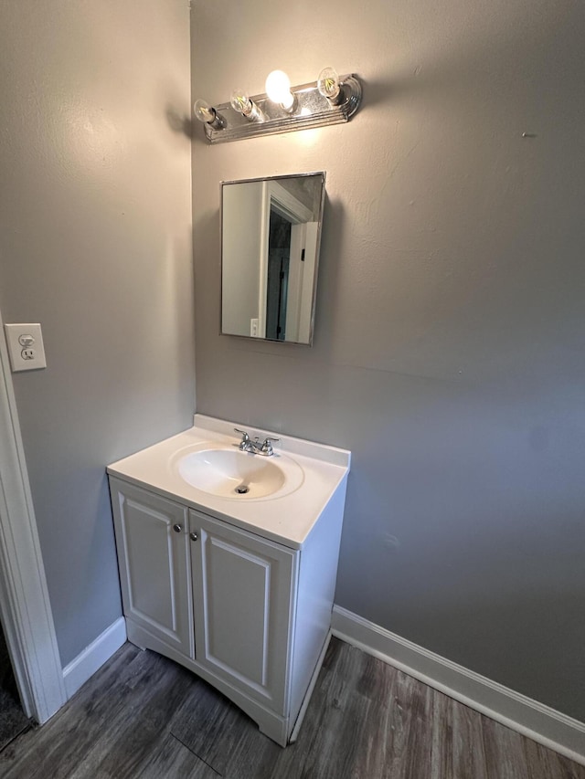 bathroom featuring hardwood / wood-style floors and vanity