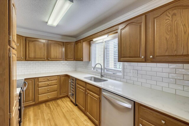 kitchen with backsplash, dishwasher, sink, and wine cooler