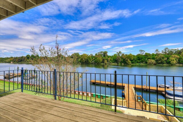 wooden deck with a water view