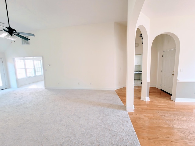 spare room with light wood-type flooring and ceiling fan