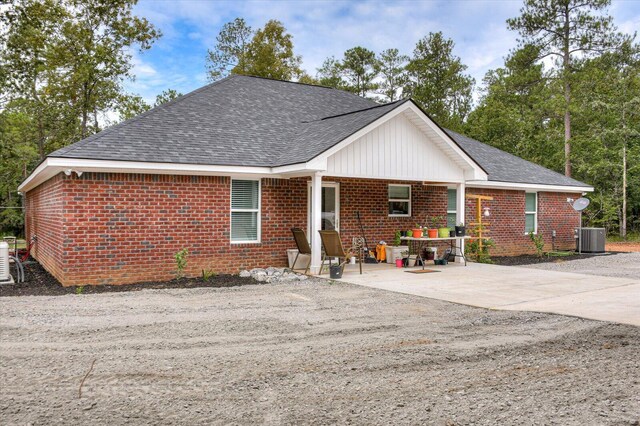 view of front of home featuring covered porch and central AC