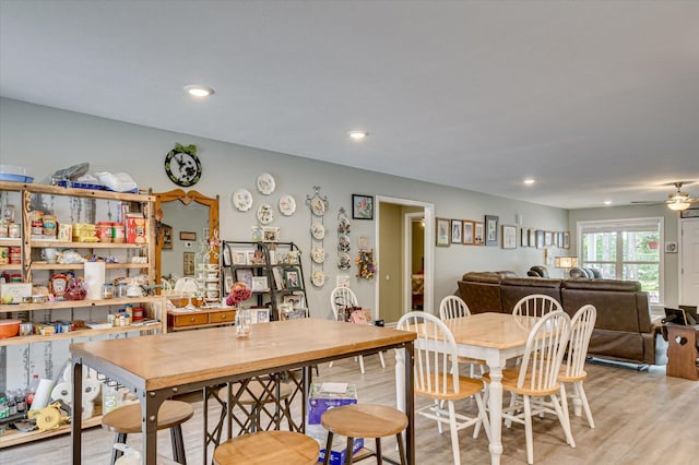 dining room featuring ceiling fan and light wood-type flooring