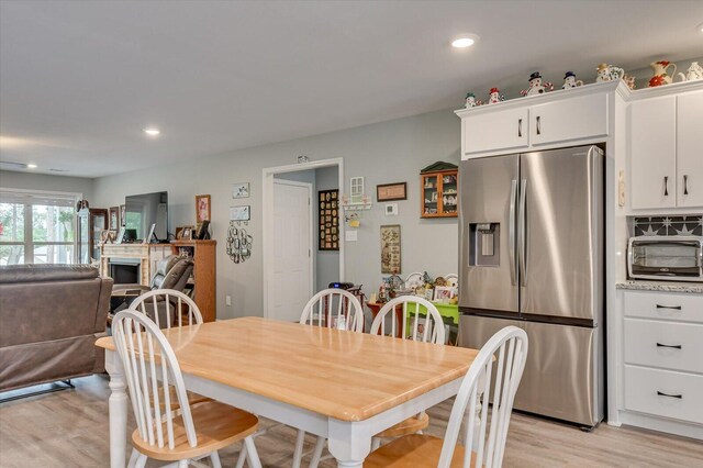 dining room with light hardwood / wood-style flooring