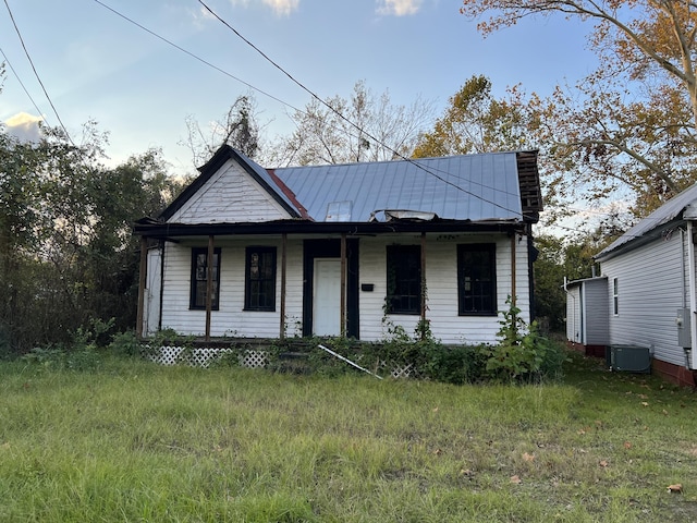 bungalow-style home featuring central AC and a porch