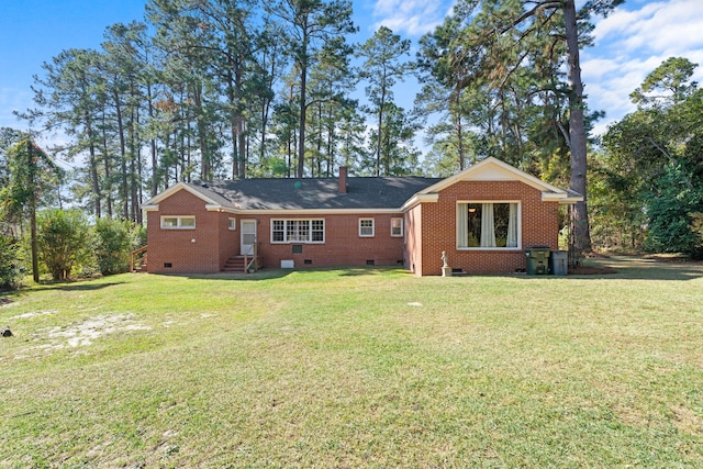 back of house with a yard