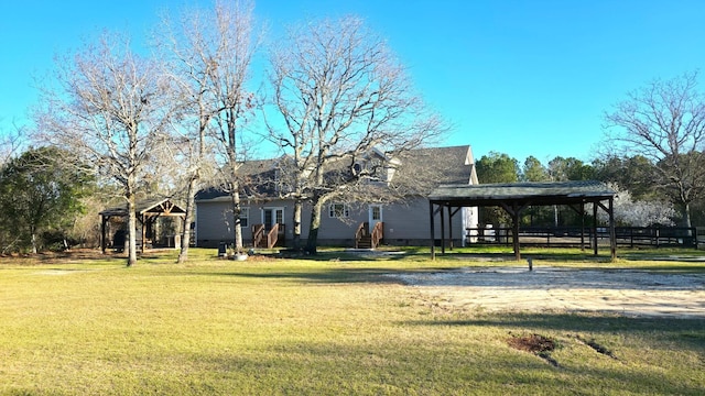 view of front of home with a front yard, crawl space, a gazebo, and entry steps