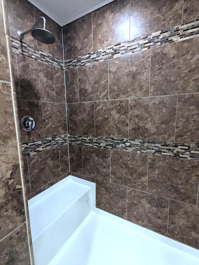 full bathroom with a tile shower