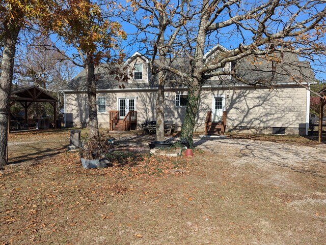 exterior space with entry steps and a gazebo