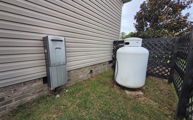 exterior details with crawl space, heating fuel, and fence