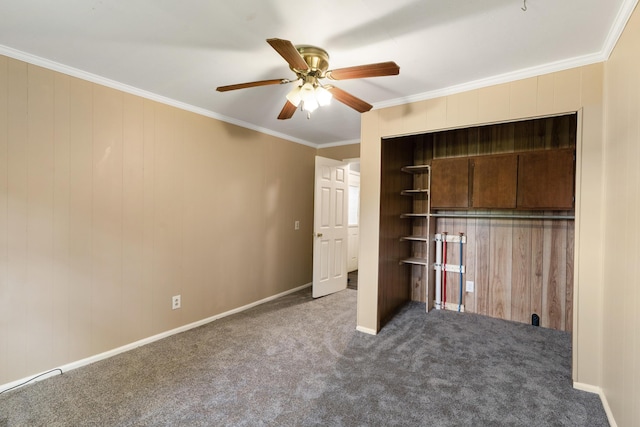 5950 E Ga Highway 24, Louisville, GA 30434 - unfurnished bedroom featuring carpet floors, ornamental molding, ceiling fan, wooden walls, and baseboards