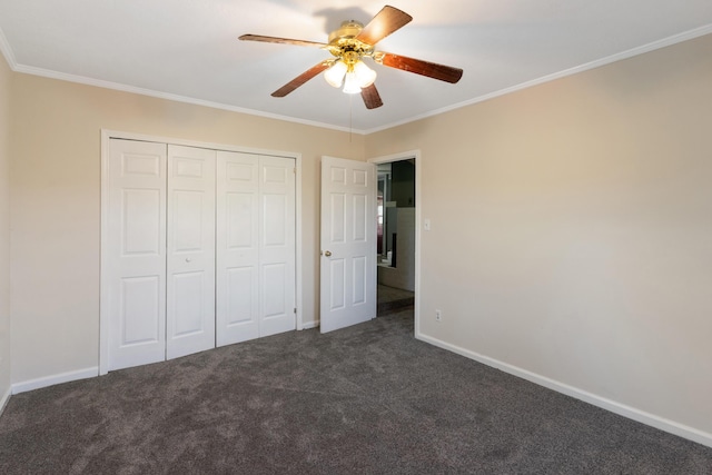 5950 E Ga Highway 24, Louisville, GA 30434 - unfurnished bedroom with crown molding, dark carpet, baseboards, a closet, and a ceiling fan