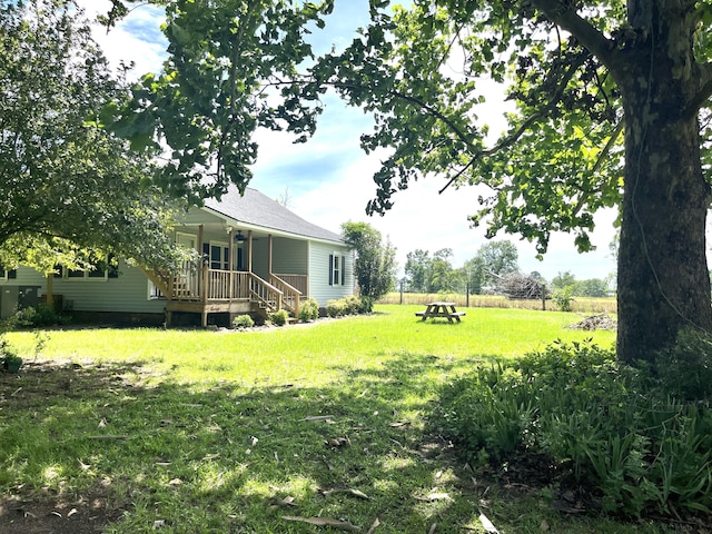 5950 E Ga Highway 24, Louisville, GA 30434 - view of grassy yard with a porch