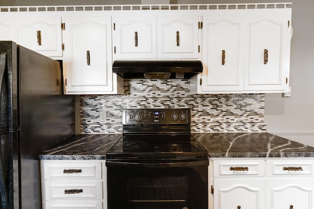5950 E Ga Highway 24, Louisville, GA 30434 - kitchen with black electric range, under cabinet range hood, freestanding refrigerator, white cabinetry, and decorative backsplash