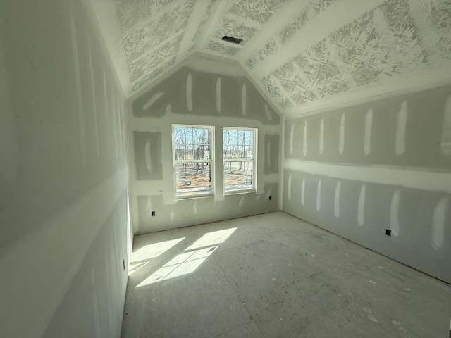 bonus room featuring lofted ceiling