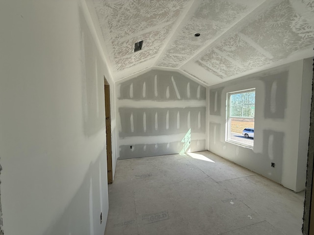 bonus room featuring vaulted ceiling