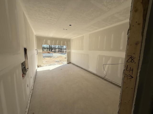 spare room with concrete flooring and a textured ceiling