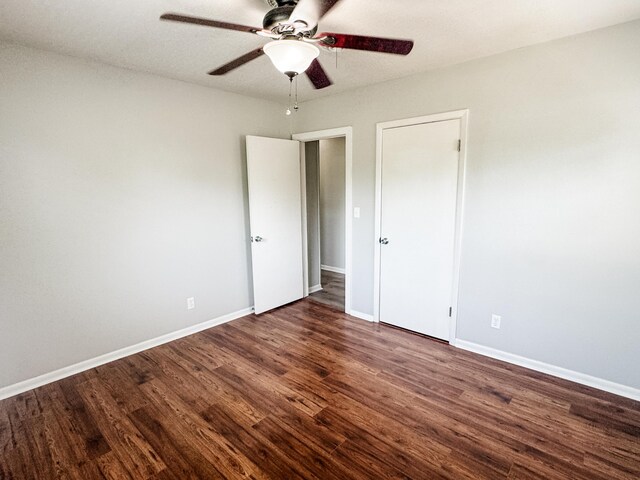 2255 Walden Dr, Augusta, GA 30904 - unfurnished bedroom with wood finished floors, baseboards, and a ceiling fan