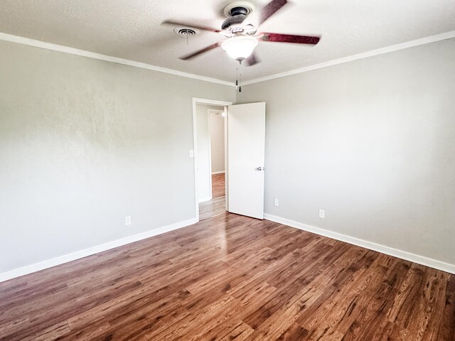 2255 Walden Dr, Augusta, GA 30904 - empty room with a ceiling fan, wood finished floors, baseboards, and crown molding