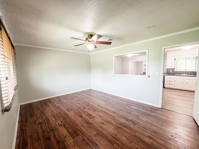 2255 Walden Dr, Augusta, GA 30904 - spare room featuring a sink, ceiling fan, ornamental molding, a textured ceiling, and wood finished floors