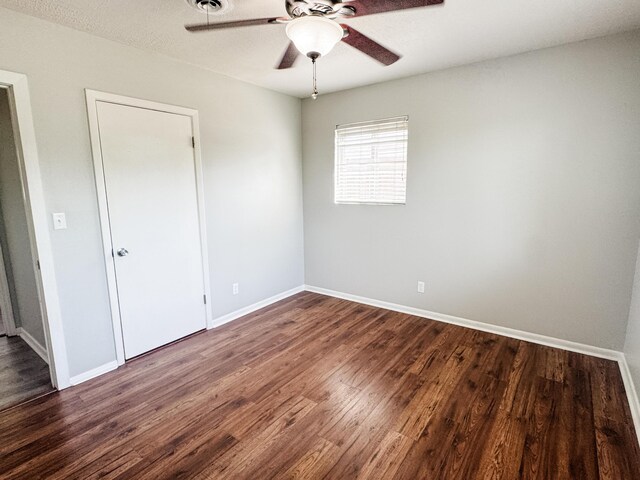 2255 Walden Dr, Augusta, GA 30904 - spare room featuring ceiling fan, dark wood-type flooring, and baseboards