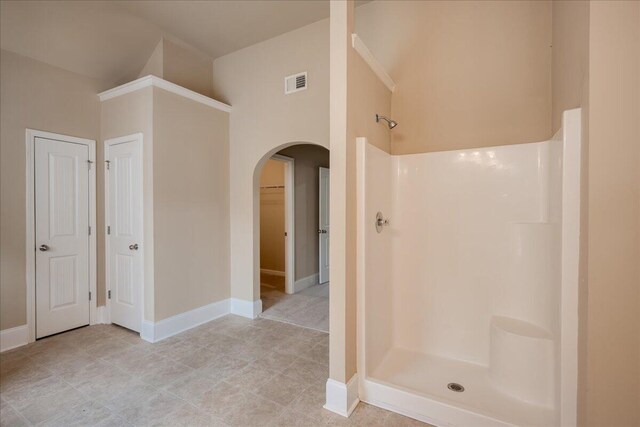 2083 Willhaven Dr, Augusta, GA 30909 - bathroom with a stall shower, a walk in closet, baseboards, and tile patterned flooring