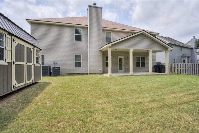 2083 Willhaven Dr, Augusta, GA 30909 - rear view of property with a patio, a chimney, central AC unit, and an outbuilding
