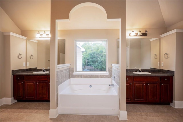 2083 Willhaven Dr, Augusta, GA 30909 - bathroom featuring vaulted ceiling, a bath, and two vanities