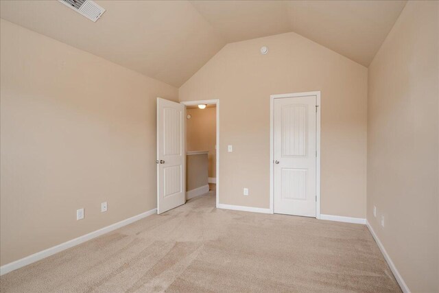 2083 Willhaven Dr, Augusta, GA 30909 - unfurnished bedroom featuring light colored carpet, lofted ceiling, and baseboards