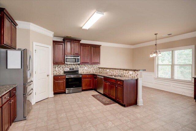 2083 Willhaven Dr, Augusta, GA 30909 - kitchen with stainless steel appliances, a sink, a peninsula, a chandelier, and light floors