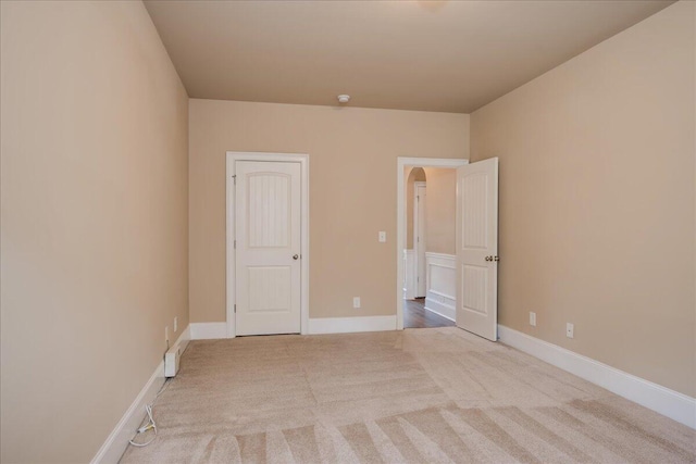2083 Willhaven Dr, Augusta, GA 30909 - unfurnished bedroom with carpet flooring, arched walkways, and baseboards