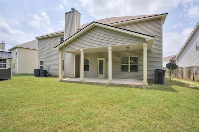2083 Willhaven Dr, Augusta, GA 30909 - rear view of house featuring a patio area, a chimney, and central AC