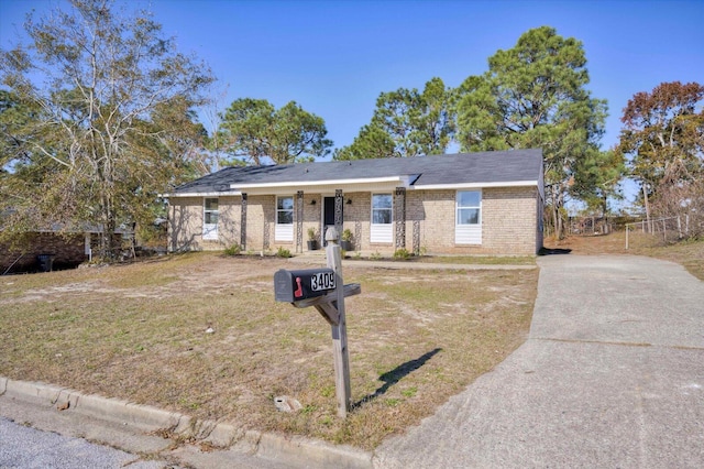 single story home with a porch and a front yard