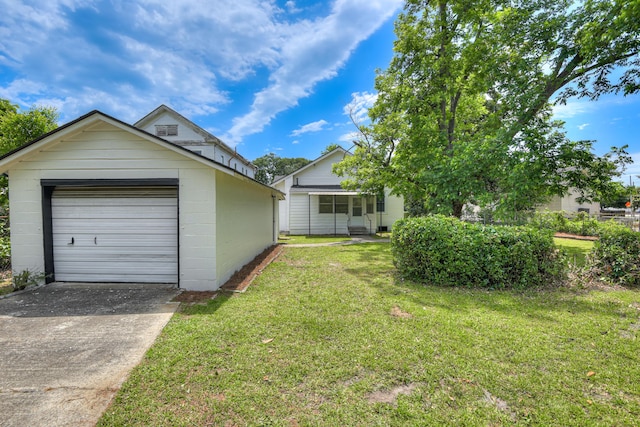 807 Crawford Ave, Augusta, GA 30904 - view of green lawn with concrete driveway and a garage