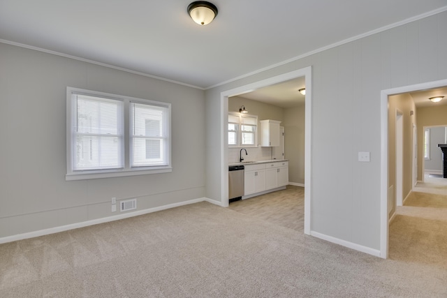 807 Crawford Ave, Augusta, GA 30904 - unfurnished living room with ornamental molding, light colored carpet, a sink, and baseboards