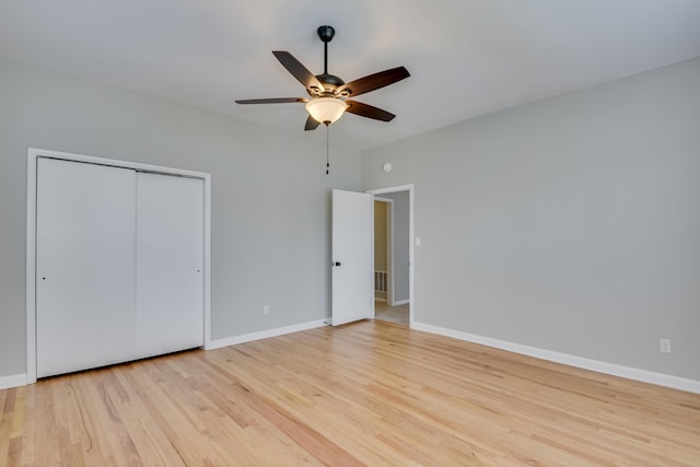 807 Crawford Ave, Augusta, GA 30904 - unfurnished bedroom featuring light wood finished floors, a closet, baseboards, and a ceiling fan