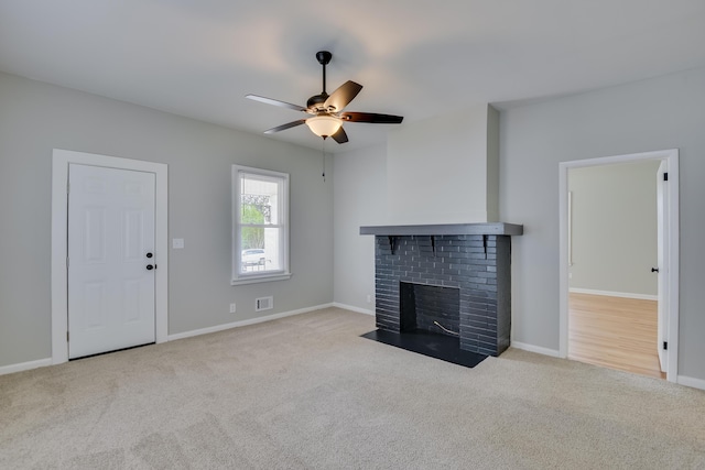 807 Crawford Ave, Augusta, GA 30904 - unfurnished living room with carpet, ceiling fan, a fireplace, and baseboards