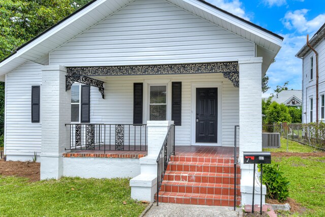 807 Crawford Ave, Augusta, GA 30904 - shotgun-style home featuring a porch and central air condition unit